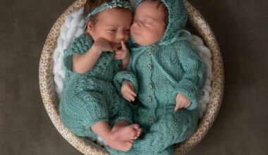 a couple of babies laying next to each other