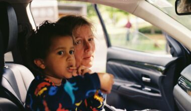 a person and a child in a car